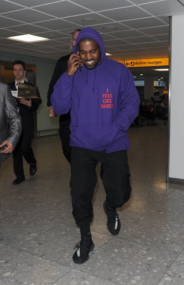 Kanye West arriving at Heathrow Airport all smiles. Kanye was wearing an as yet unreleased pair of his Yeezy Boost 350 trainers, as well as a Pablo hoodie, to promote his new album Featuring: Kanye West Where: London, United Kingdom When: 10 Apr 2016 Credit: Will Alexander/WENN.com