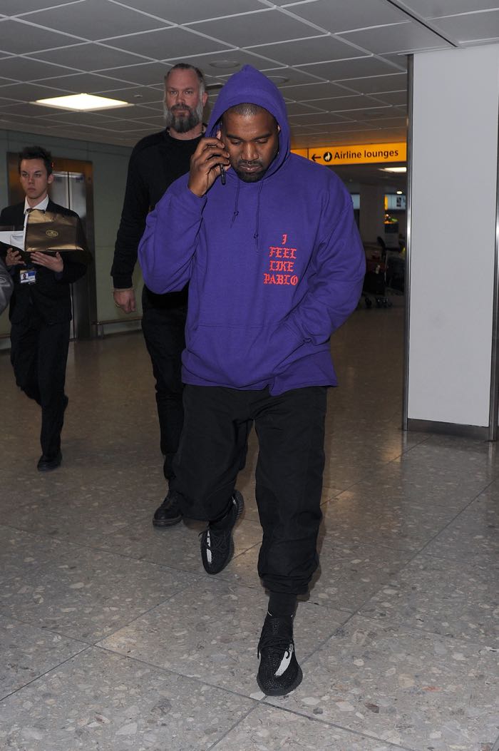 Kanye West arriving at Heathrow Airport all smiles. Kanye was wearing an as yet unreleased pair of his Yeezy Boost 350 trainers, as well as a Pablo hoodie, to promote his new album Featuring: Kanye West Where: London, United Kingdom When: 10 Apr 2016 Credit: Will Alexander/WENN.com