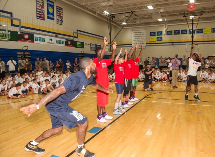 Cleveland Cavaliers star Kyrie Irving plays with members of the Boys & Girls Clubs of Cleveland at his basketball camp Saturday, July 9, 2016, in Independence, Ohio. Kids Foot Locker donated 190 pairs of sneakers to BGCC, to match Irving's 190 points scored during the NBA championship series. (Phil Long/AP Images for Kids Foot Locker)