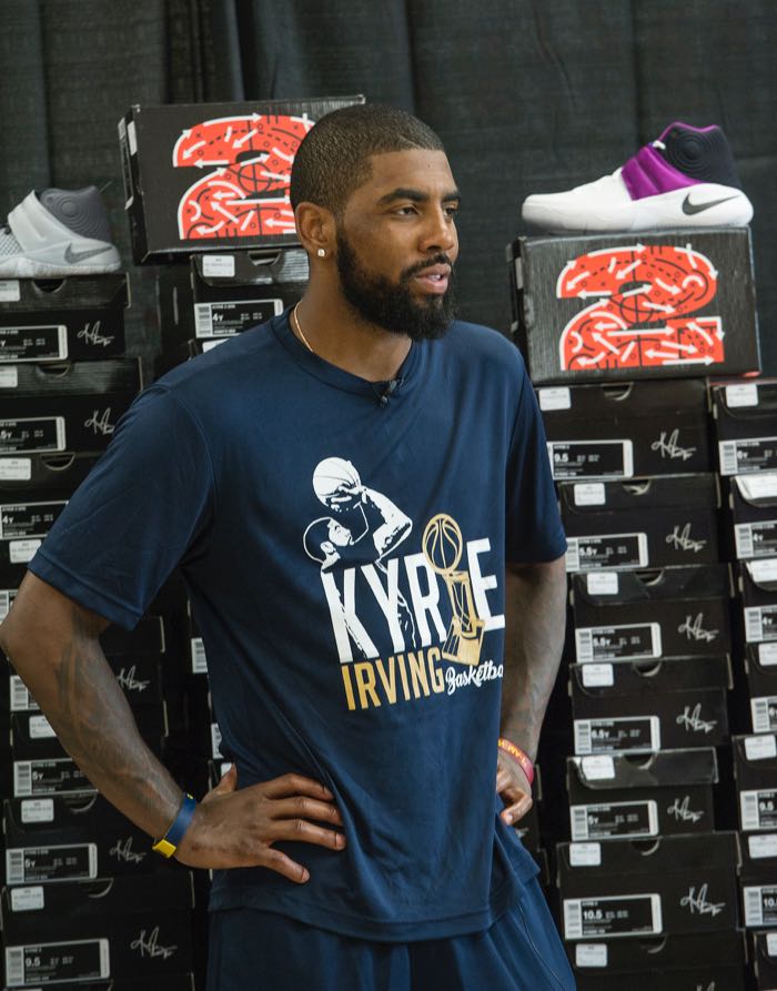 Cleveland Cavaliers star Kyrie Irving, in partnership with Kids Foot Locker, donated 190 pairs of sneakers to Boys & Girls Clubs of Cleveland, Saturday, July 9, 2016, in Independence, Ohio. The donation matched Irving's 190 points scored during the NBA championship series. (Phil Long/AP Images for Kids Foot Locker)