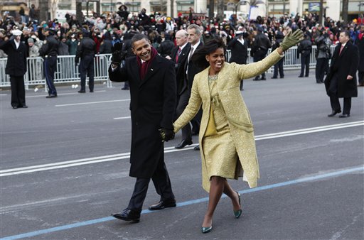 President Barack Obama and first lady Michelle Obama walk the inaugural parade route in Washington, Jan. 20, 2009. (AP Photo/Charles Dharapak)