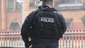 Armed British Transport Police patrol Manchester Piccadilly Train Station