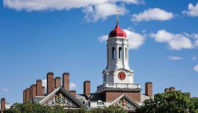 Dunster House dormitory with clock tower, Harvard University...