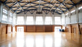 Japanese high school. An empty school gymnasium. Basketball court markings