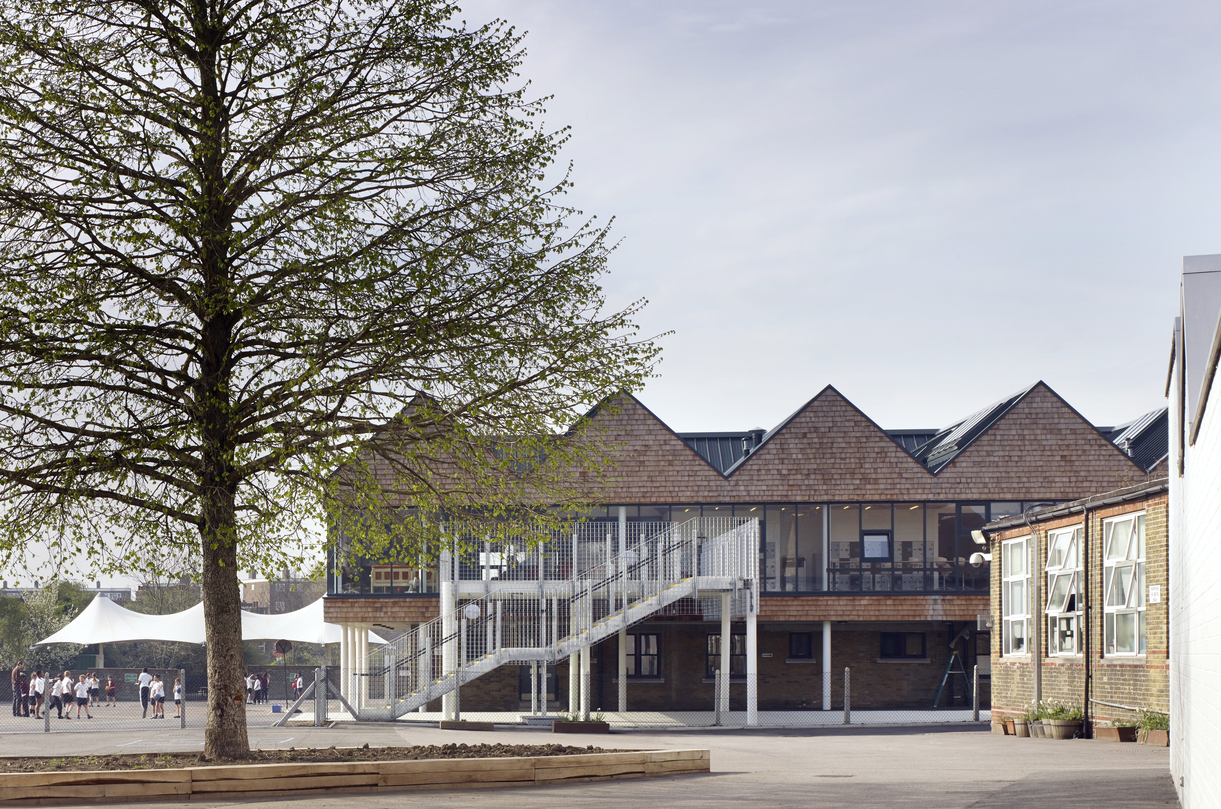 Classroom exterior. Whitehorse Manor Junior School at Pegaus Academy, Thornton Heath, United Kingdom. Architect: Hayhurst and Co., 2014.