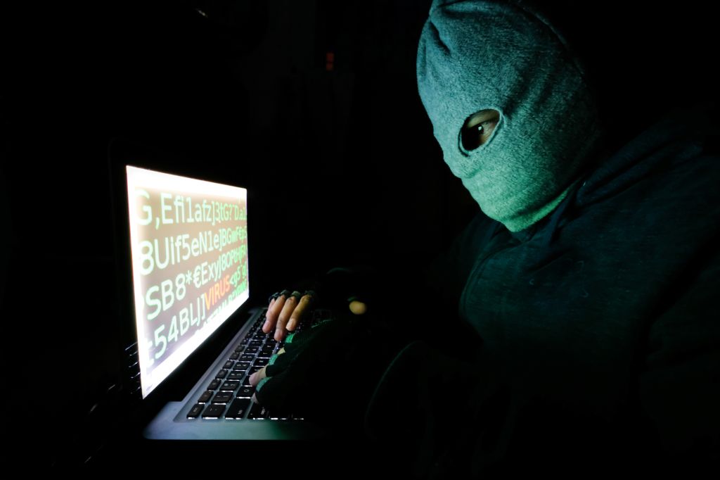 Hacker stealing password and identity, computer crime