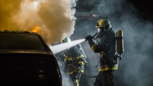 Firefighters using extinguisher