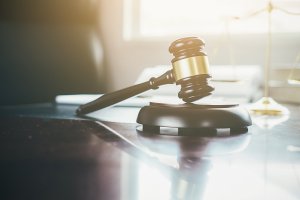 Close-Up Of Gavel On Table