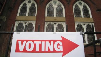 A sign pointing to a polling station is