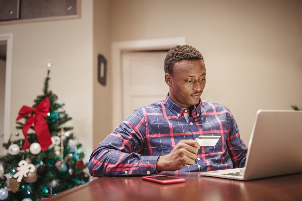 African men shopping Christmas present online
