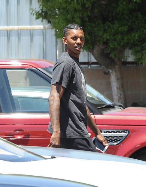 Nick Young heads to an office building in Van Nuys