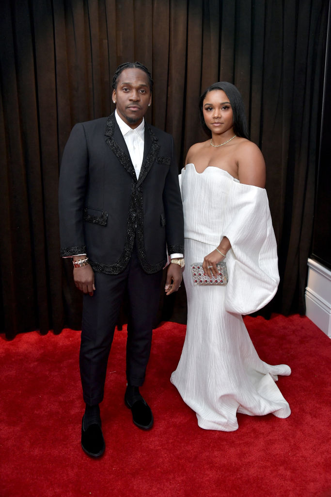 Not loving Pusha T's look but wifey is a sight to behold.