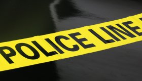 Police Caution Tape on a black background
