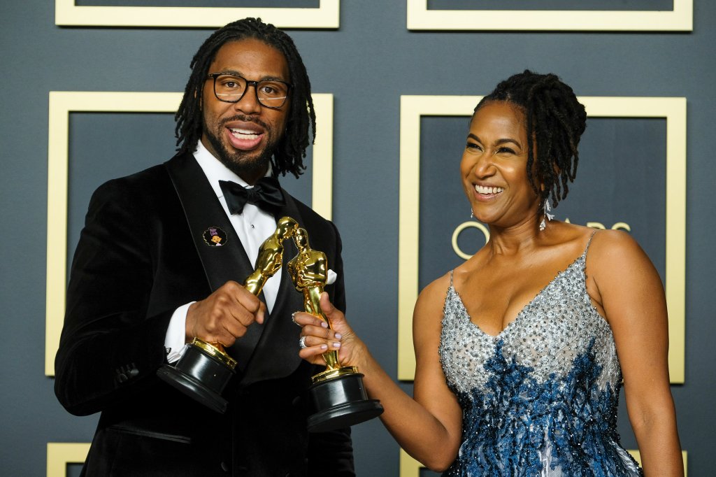 Matthew A. Cherry & Karen Rupert Toliver poses with the Oscar for Short Film (Animated) in the film Hair Love during the the 92nd Academy Awards, 2020 on Sunday 9 February 2020