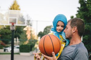 Father And Child Playing Basketball