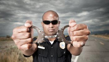 Police Officer Showing Handcuffs