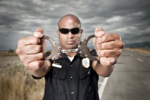 Police Officer Showing Handcuffs
