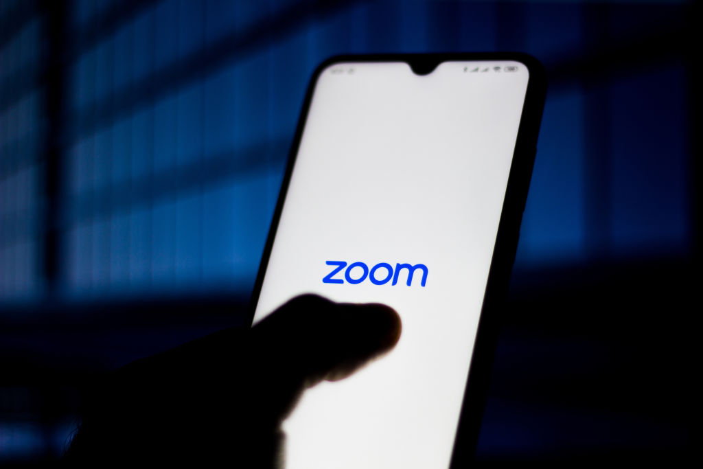 In this photo illustration Zoom Meetings logo is seen...