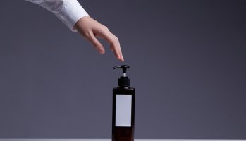 Human Hand Touch Shampoo Or Lotion Or Dishwashing Liquid In Pump Bottle,Product Shot.