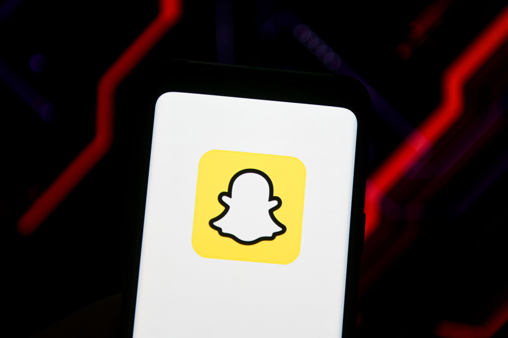 In this photo illustration a Snapchat logo seen displayed on...