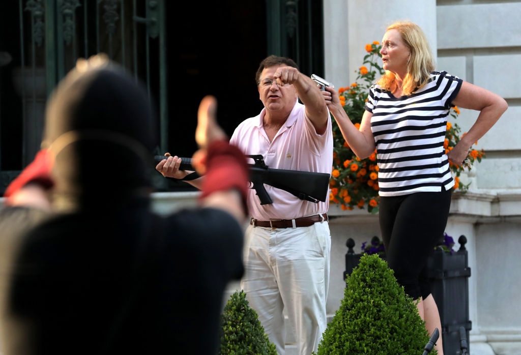 Couple points guns at protesters marching to St. Louis mayor's home to demand resignation