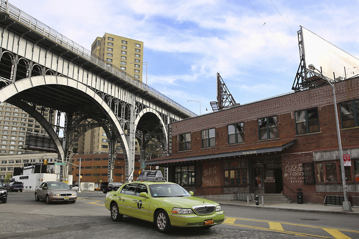 Green taxi cab (so called "boro cab") by the 125th Street Viaduct in Harlem, Manhattan, New York City
