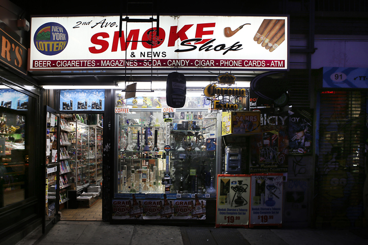 Tobacconist store in the East Village at night. New York City, USA