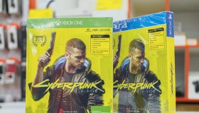 Cyberpunk game discs for PlayStation and XBox consoles. The...