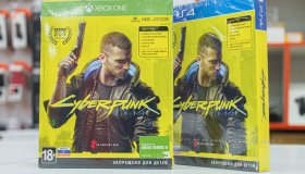 Cyberpunk game discs for PlayStation and XBox consoles. The...