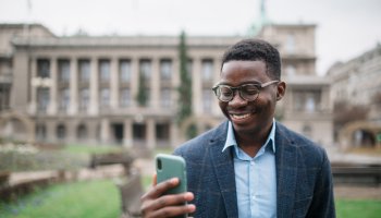 Young African American businessman using a smart phone