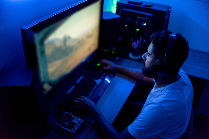 Man playing on the computer. Streamer, gamer.