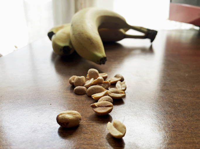 Peanuts and bananas on kitchen table