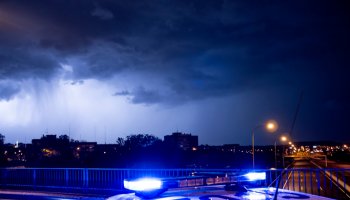 Spain, Madrid,Close-upof police emergency lights glowing during night intervention
