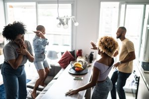 Friends dancing and having fun at home
