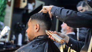 Young man having a haircut at a barbershop