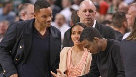 Boston, MA - Comedian/actor Chris Rock, right, chats with Will Smith and Jada Pinkett-Smith at Game 5 of the Eastern Conference Semifinals at TD Garden on Monday, May 21, 2012. Staff Photo by Matthew West.