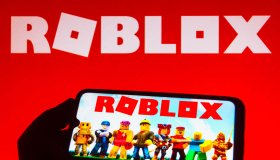 In this photo illustration the Roblox logo seen displayed on...