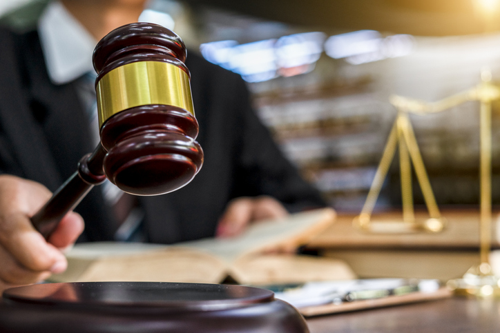 Close up of judge holding gavel