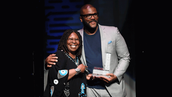 Whoopi Goldberg presents Tyler Perry the Impact Award at the Apollo Theater Spring Benefit
