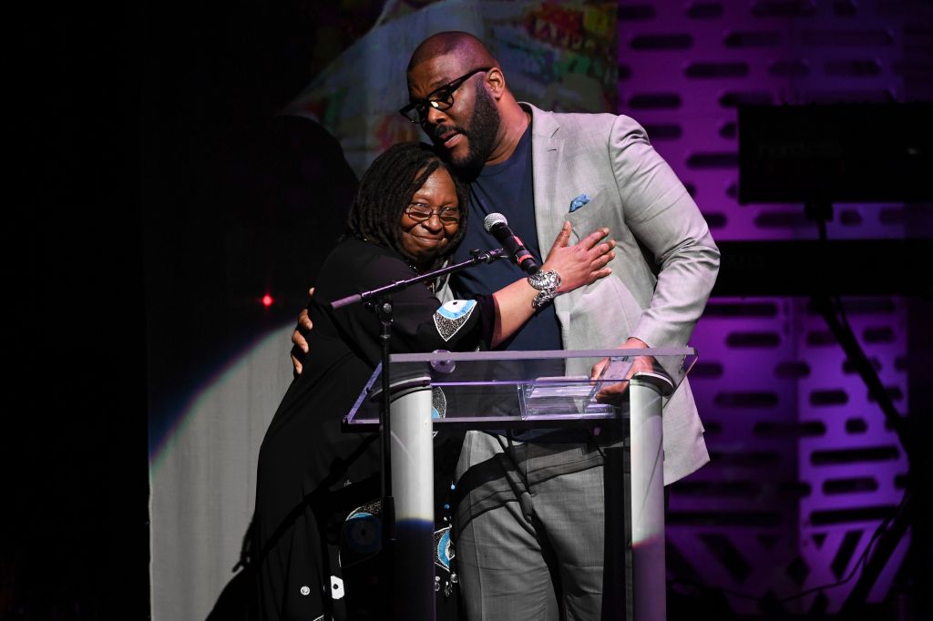 Whoopi Goldberg presents Tyler Perry the Impact Award at the Apollo Theater Spring Benefit.