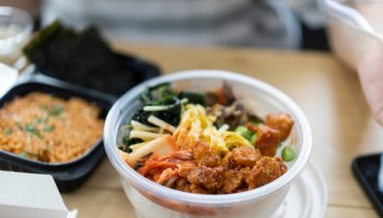 Top view takeaway Bibimbap and fried chicken Korean style Korean food and cuisine Delivery food service at home