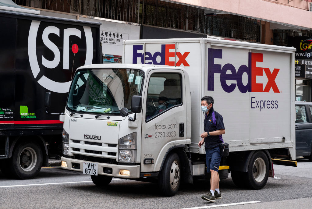 A worker of the American FedEx Express delivery is seen...