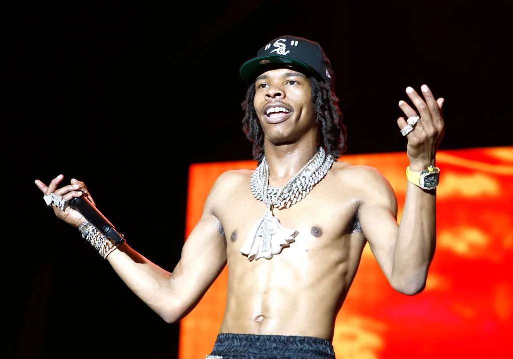 Lil Baby's Security Guard Shoves Fan Who Hopped On Stage