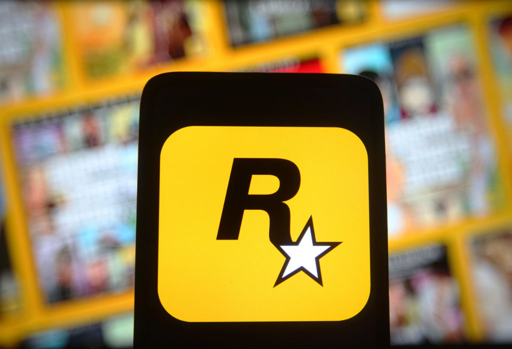 In this photo illustration, a Rockstar Games Inc logo of a...