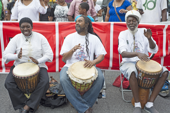 Conga drummers perform at the annual Harlem Festival held on 135th Street in Harlem, NYC.