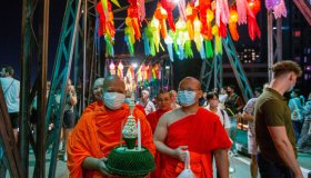 Thai Buddhist monk holds a "Krathong" during the Loy...
