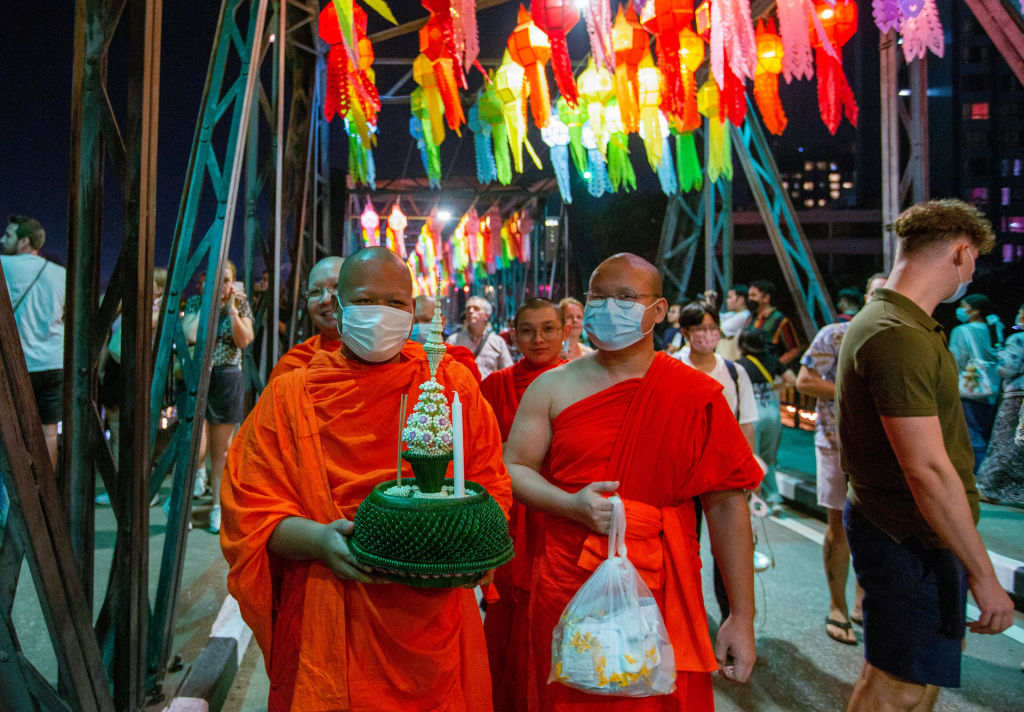 Thai Buddhist monk holds a "Krathong" during the Loy...