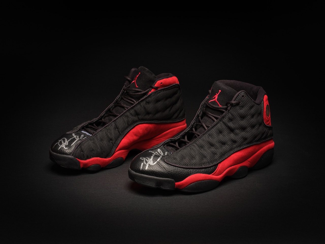 A pair of rare, game-worn, autographed Air Jordan 13's from Sotheby's auction sold for a record $2.2 million.