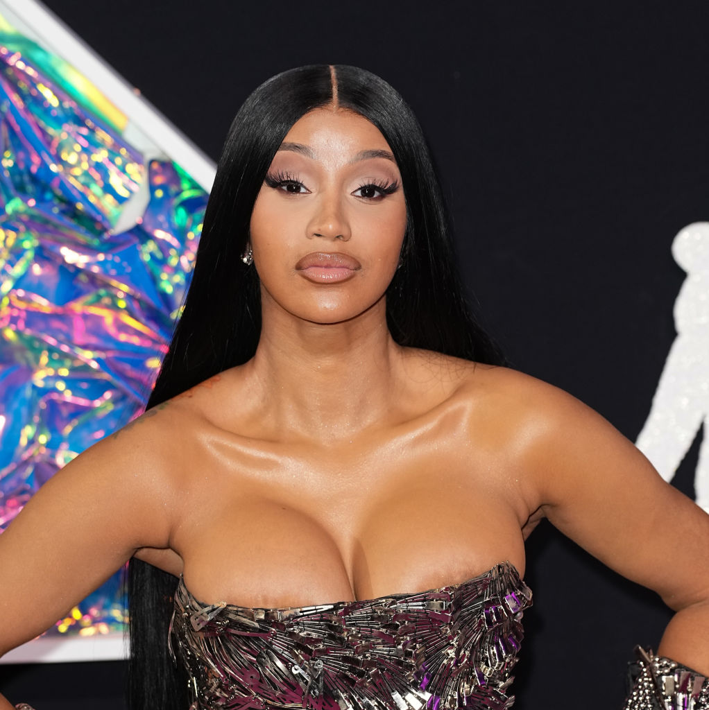 cardi b orange dress Throws Microphone at Fan Who Tossed Drink at Her: Watch Cardi B shows off the