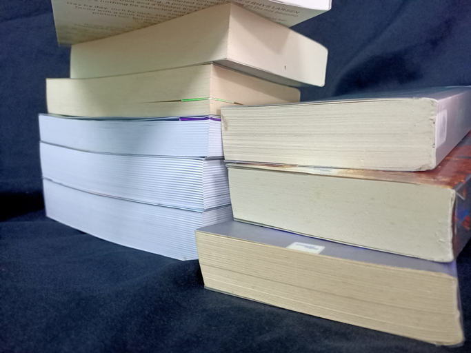 Stack of books on a black background. Back to school.